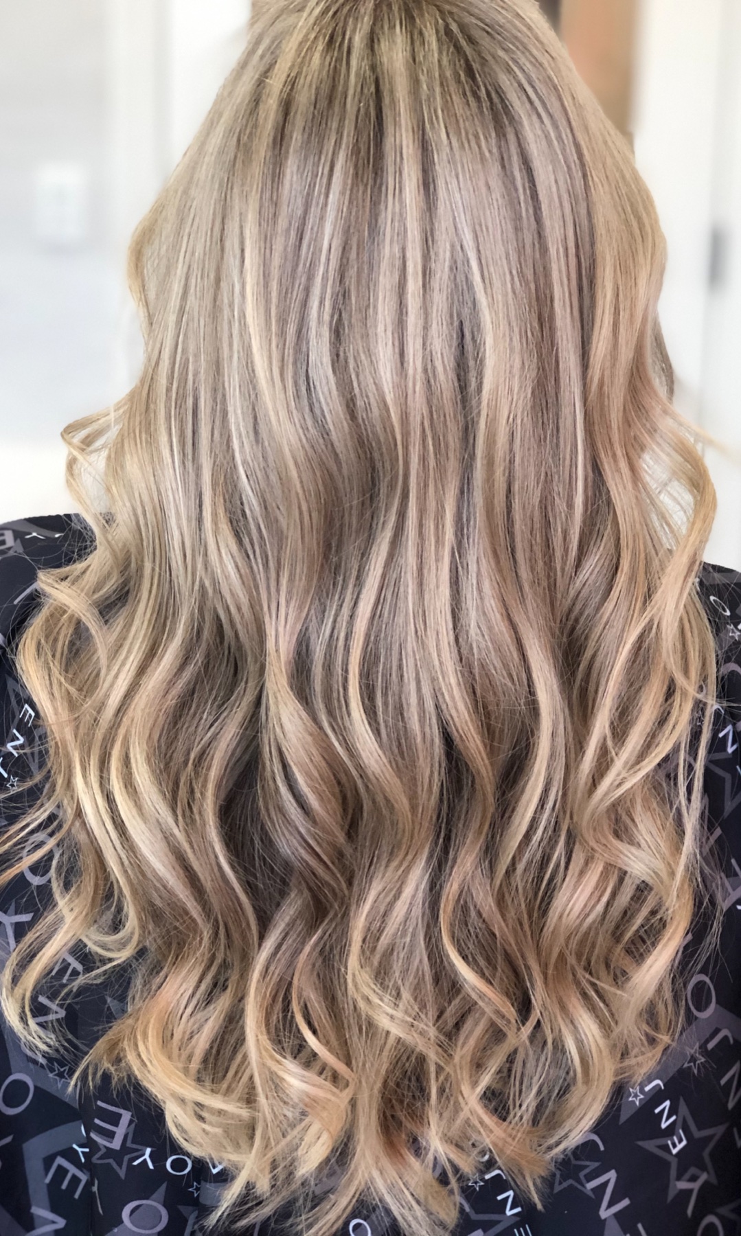 Long cool blonde waves with blended dimension